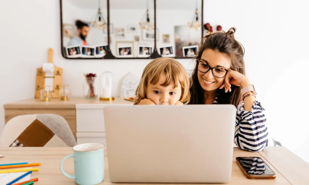 Mother and child sitting in front of a computer