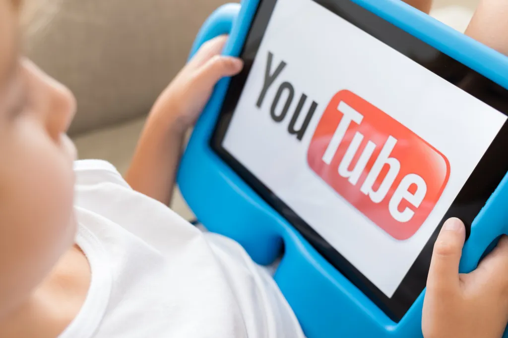 Child watching YouTube on a tablet
