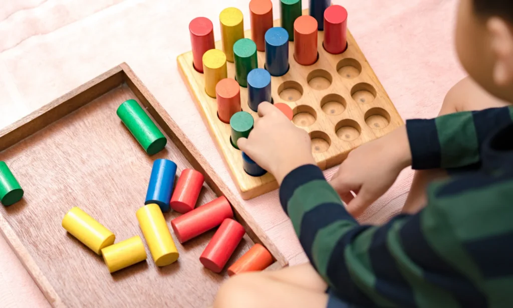 Hands of a little montessori kid