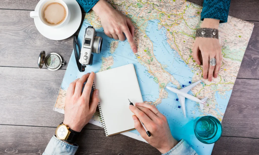 Two young people together planning trip to Europe