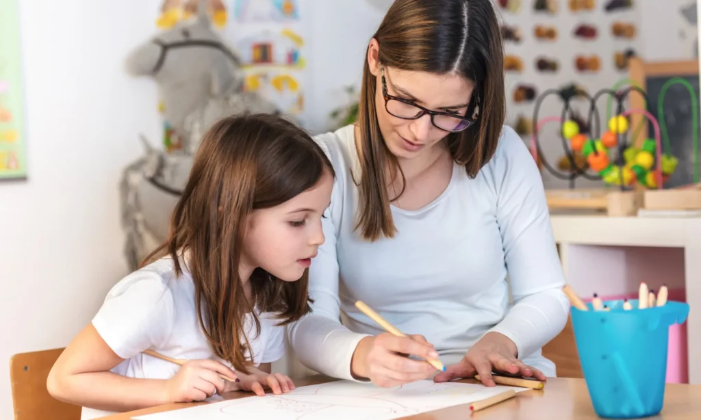 Mom teacher working with creative child