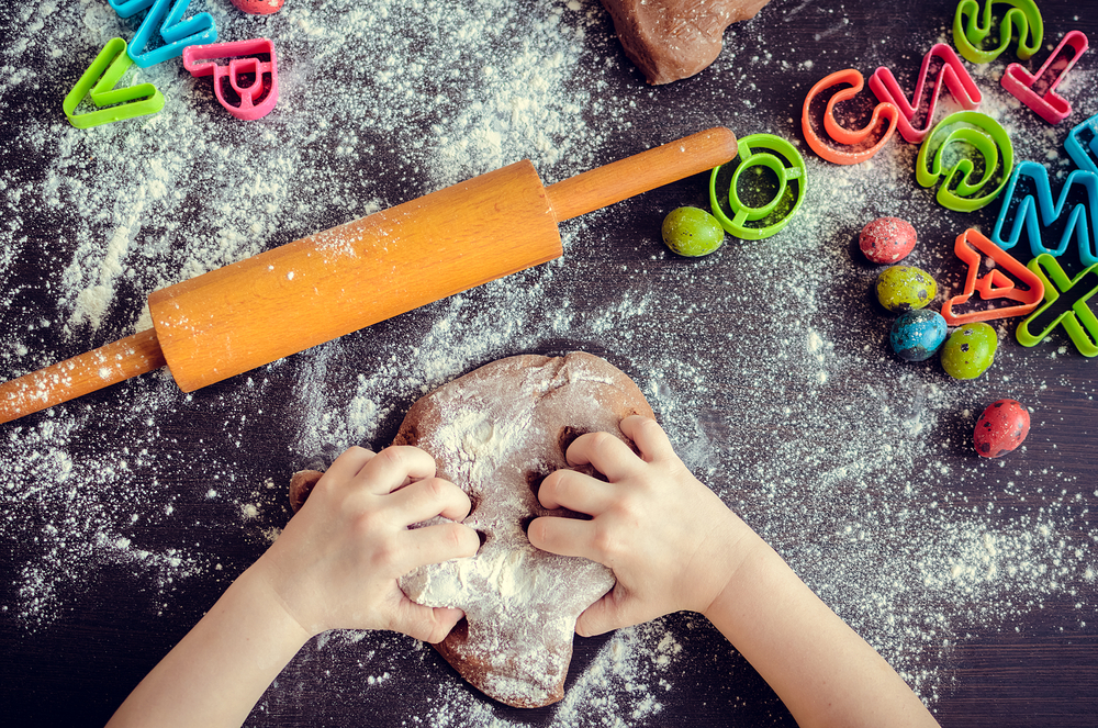 child is making dough